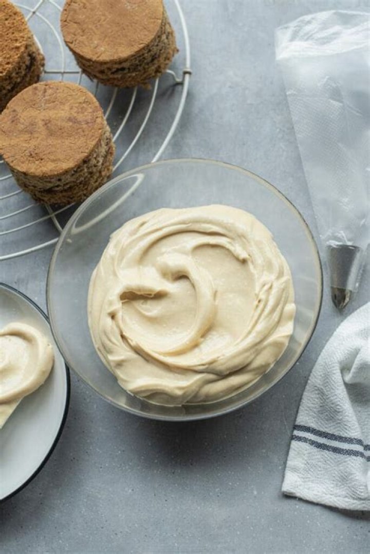 Brown sugar cream cheese frosting in a stainless steel bowl.